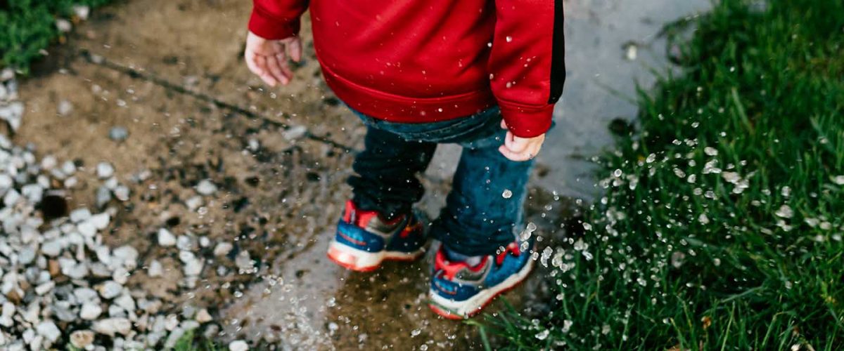 Child playing in Rain