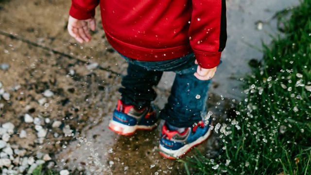 Child playing in Rain